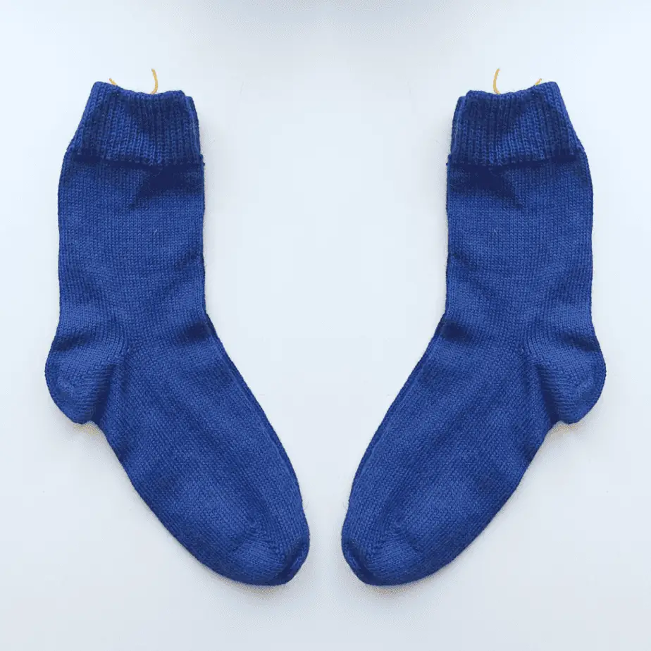 Pair of blue knitted socks, made with 100% alpaca wool. 